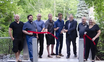 The Town of Grimsby celebrated the reopening of the Gibson Street pedestrian bridge last week. From left: Councillors Dave Sharpe, John Dunstall, Dave Kadwell, and Kevin Ritchie, MPP Sam Oosterhoff, Mayor Jeff Jordan, Regional Councillor Wayne Fertich and Coun. Lianne Vardy.